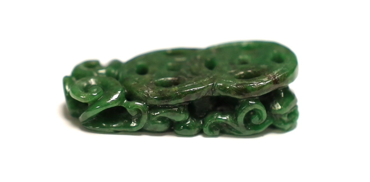 A Chinese Jadeite carving of two cash and a chilong, 3.7cm